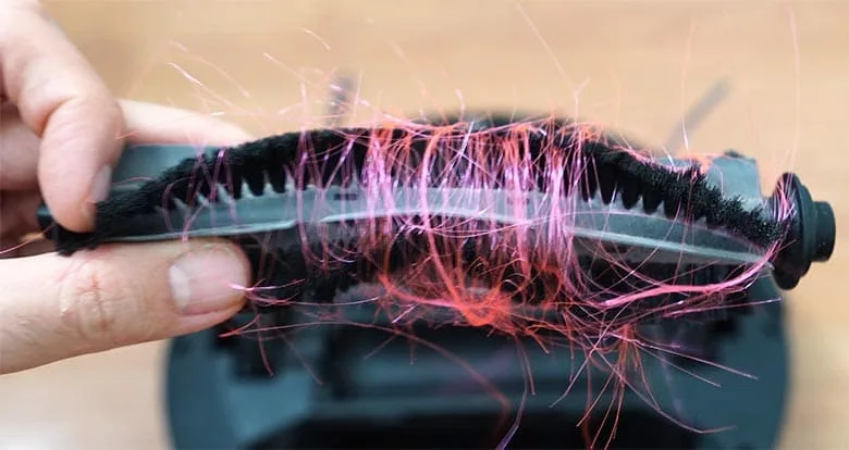 How do you clean robot vacuum brushes?